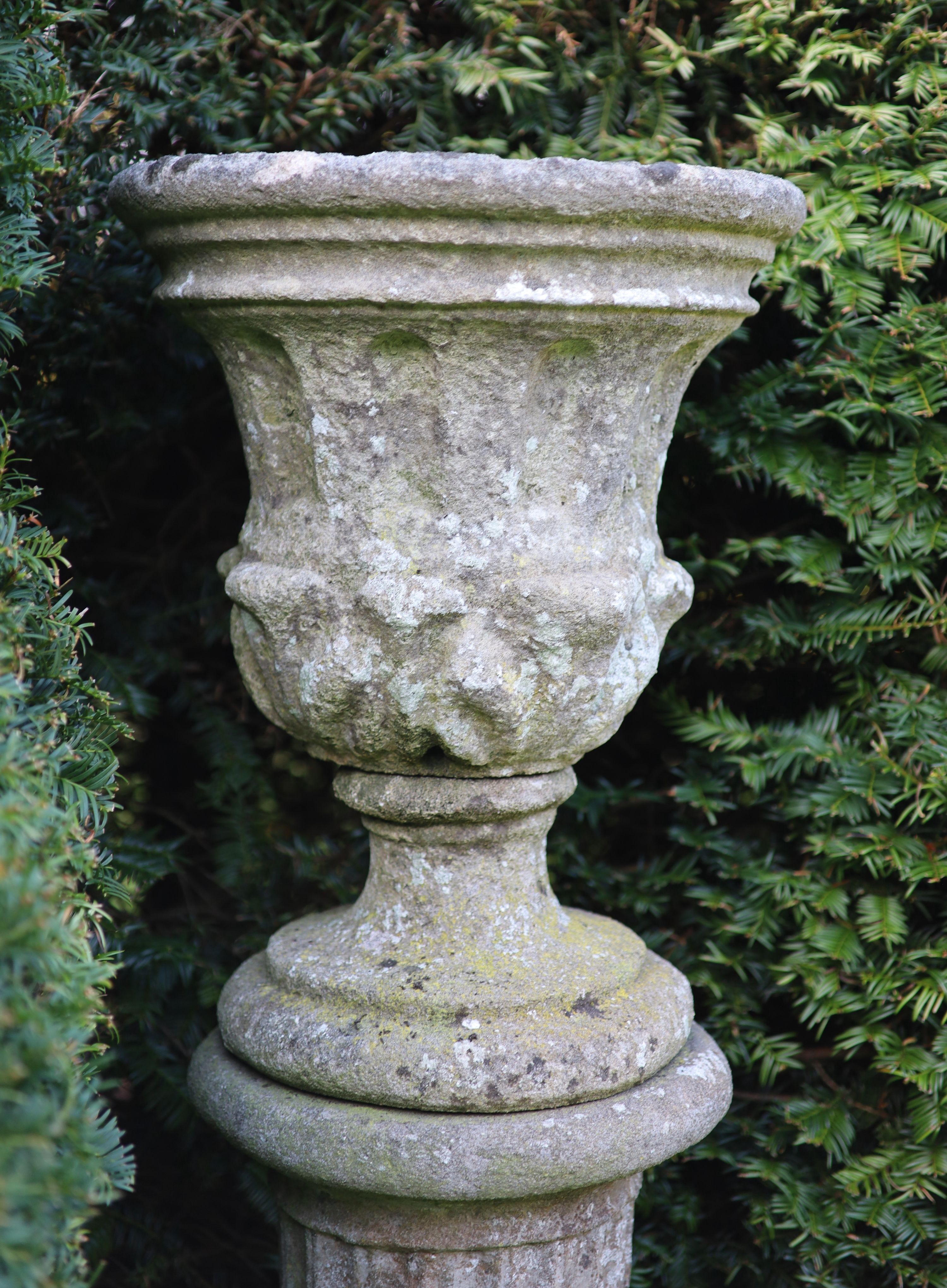 A reconstituted stone garden urn on fluted pedestal, height 112cm diameter 40cm